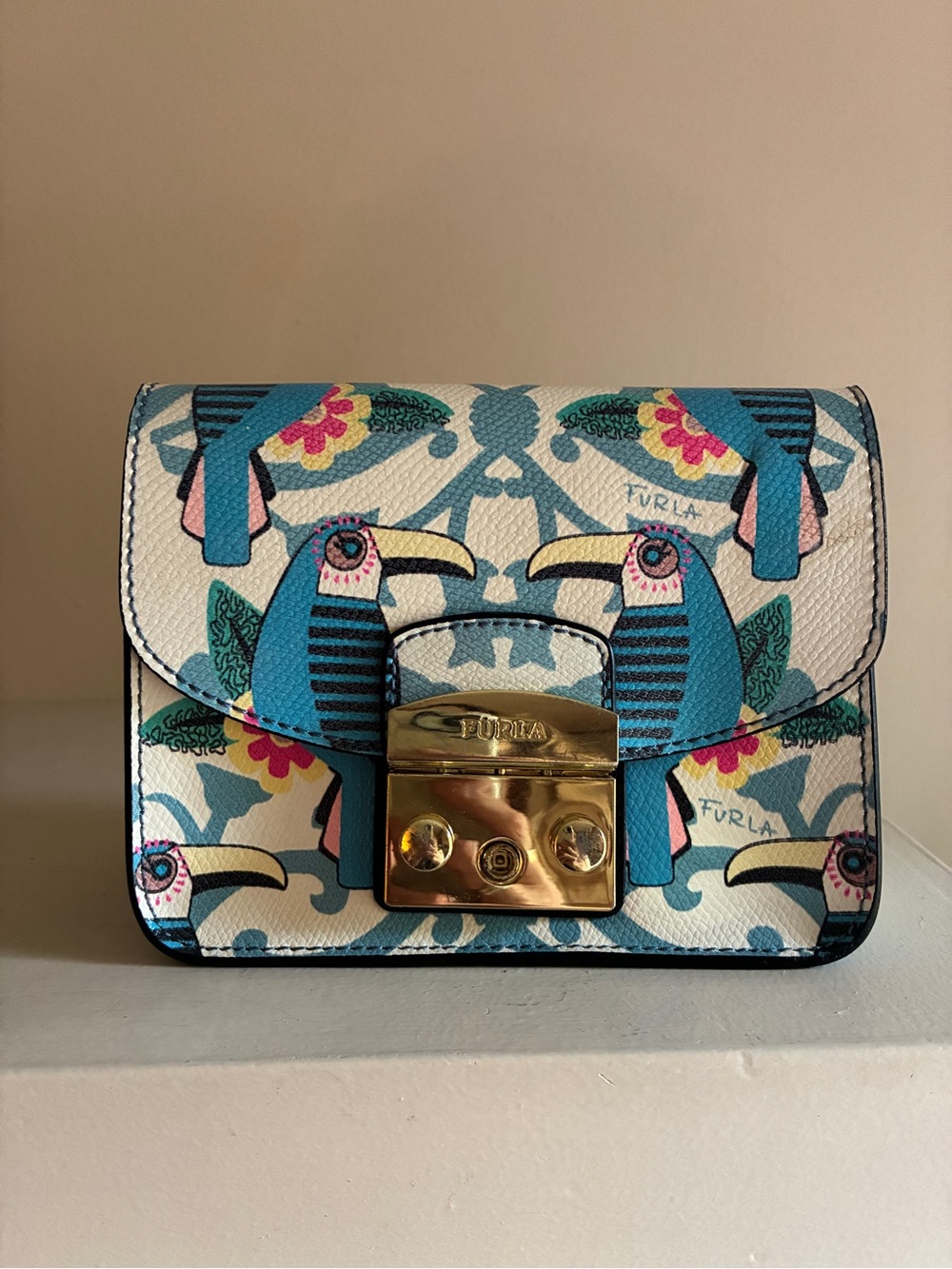 Furla Toni Cielo Mini Bag with Blue Toucan Motif and Gold Lock